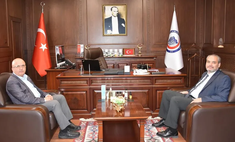 AFSÜ Rektörü Prof. Dr. Adem Aslan, Eski İl Genel Meclisi Başkanı Çoban