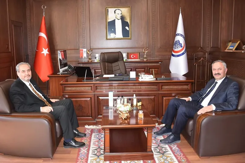 AFSÜ Rektörü Prof. Dr. Adem Aslan, Anayasa Mahkemesi Üyesi Yılmaz Akçil